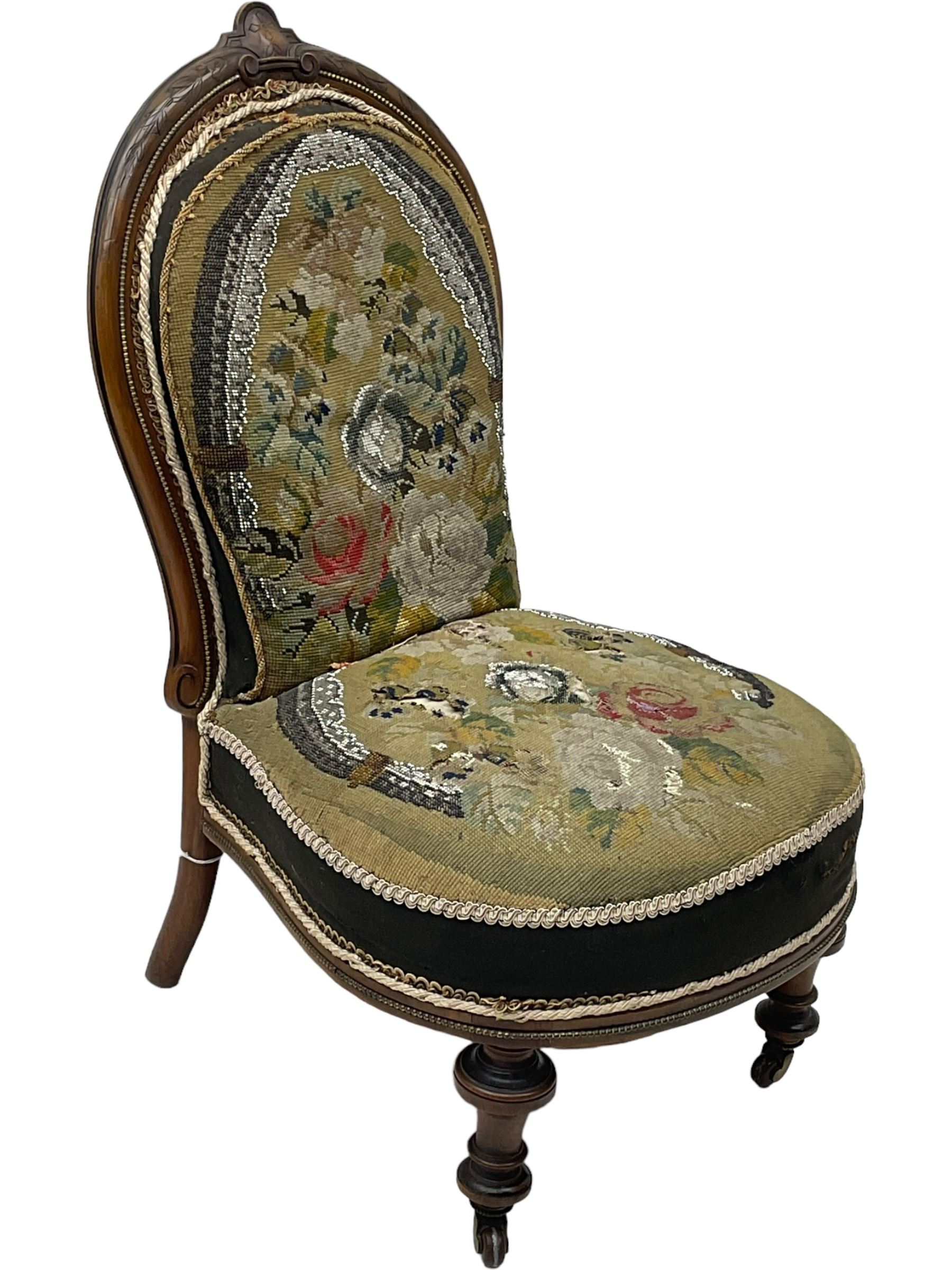 Early 20th century mahogany side chair, detailed marquetry frame, backrest with central urn motif and scrollwork inlay, arched crest rail with floral designs, cream and gold patterned fabric seat, turned front legs with brass castors (H78cm); Victorian walnut nursing chair, carved crest rail, floral needlepoint tapestry upholstery, turned front legs with ceramic castors (H81cm)