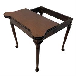 George III mahogany games table, the rectangular fold-over top with extending stepped rounded corners, opening to reveal baize lined interior with sunken counter wells, concertina action base, on lappet cabriole supports