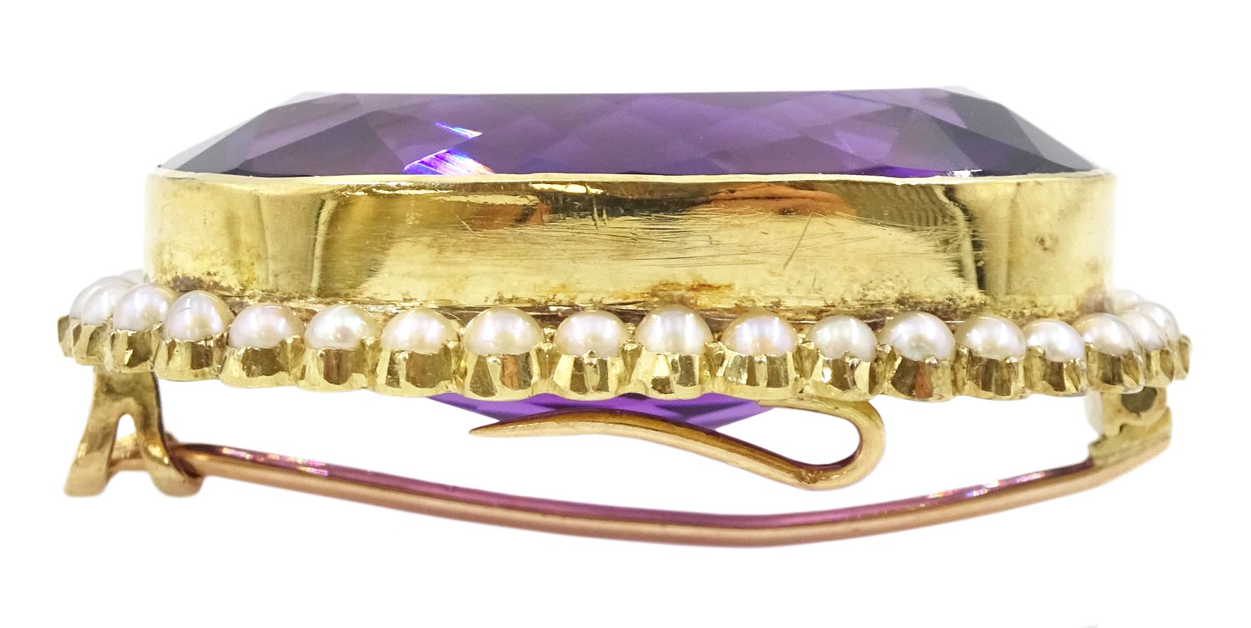 Early 20th century gold large oval cut amethyst and seed pearl brooch, stamped 15ct