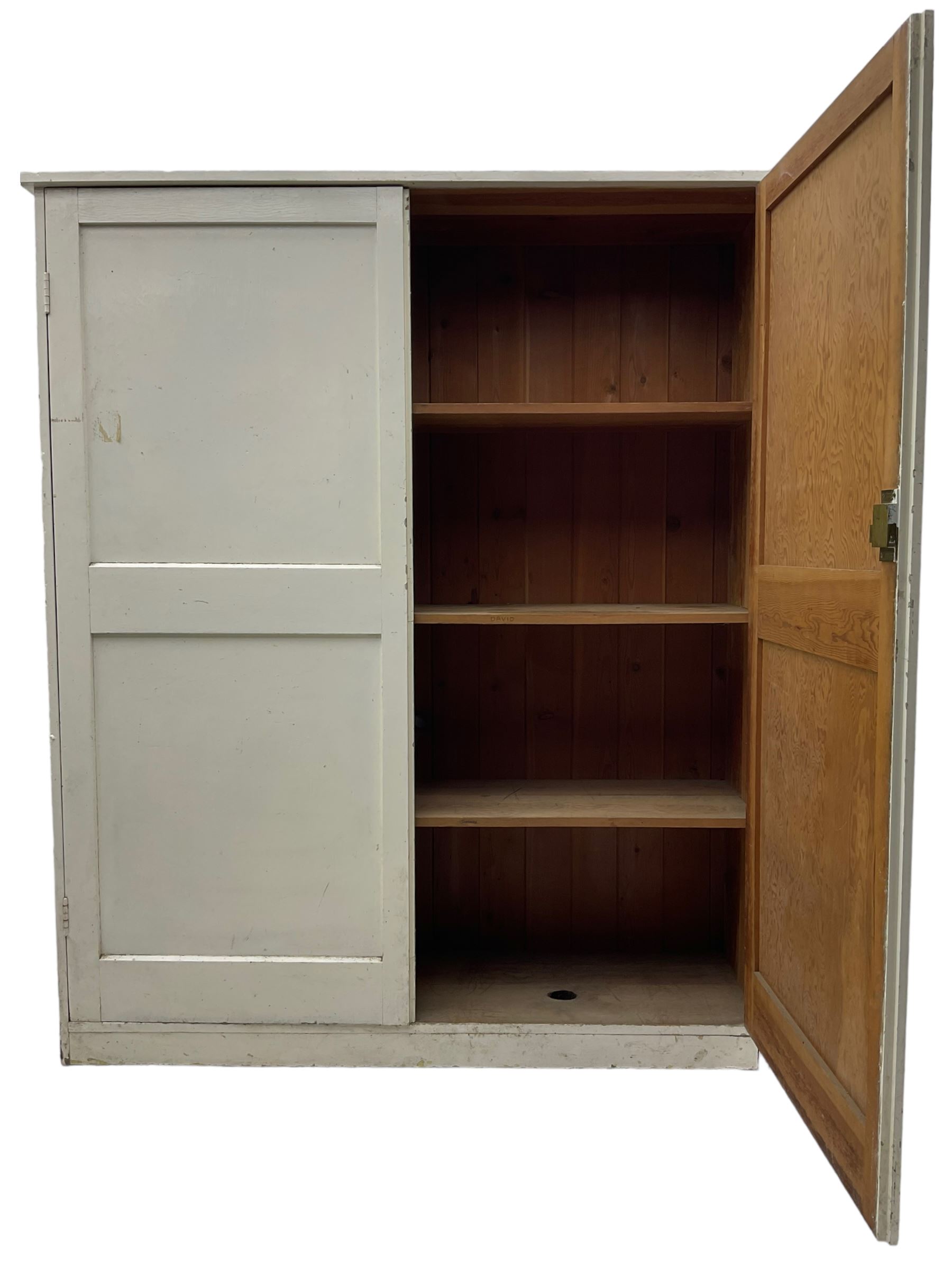 Large Victorian white painted pine cupboard, enclosed by two panelled doors 