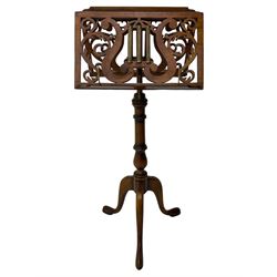 Regency design mahogany duet music stand, double-sided hinged and adjustable reading stands, scrolling leafy branch fretwork with scrolled lyre, fitted with gilt metal reeded columns, on adjustable stem, turned pedestal with tall splayed supports 