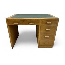 Early to mid-20th century oak pedestal desk, rectangular top with inset writing surface, f...