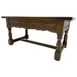 Old Charm - oak coffee table, rectangular top with glass inset over carved scalloped apron, on turned square supports connected by H-stretcher