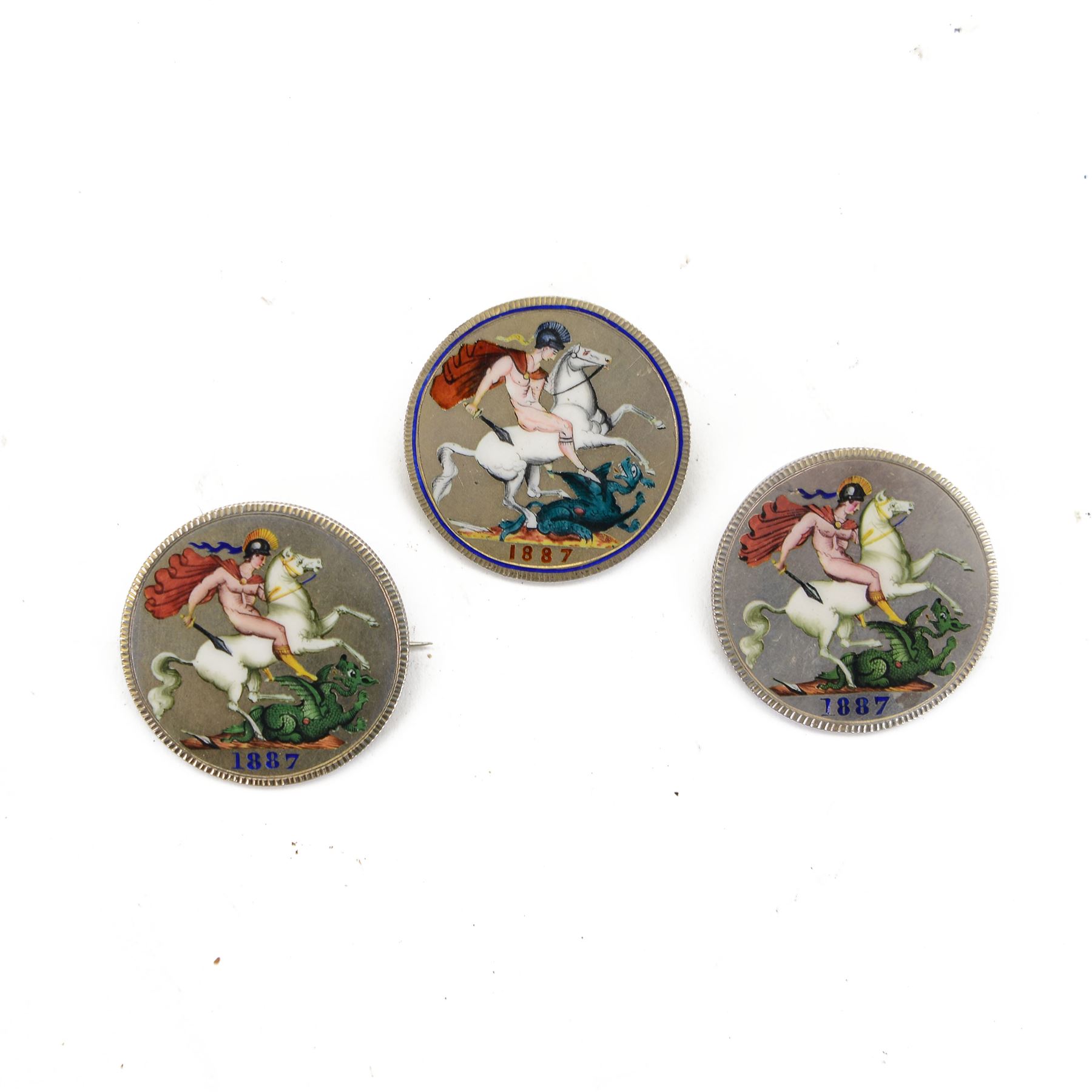 Three Queen Victoria 1887 enamelled silver crown coins, all with brooch and loop mounts