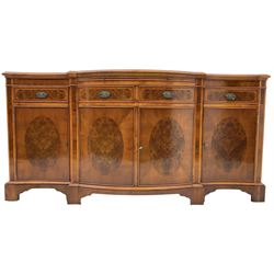 Wade - Georgian design yew wood bow-fronted sideboard, projecting moulded top over four cockbeaded frieze drawers, the central two with pull-out slides, four cupboards below with figured veneers, raised on bracket feet