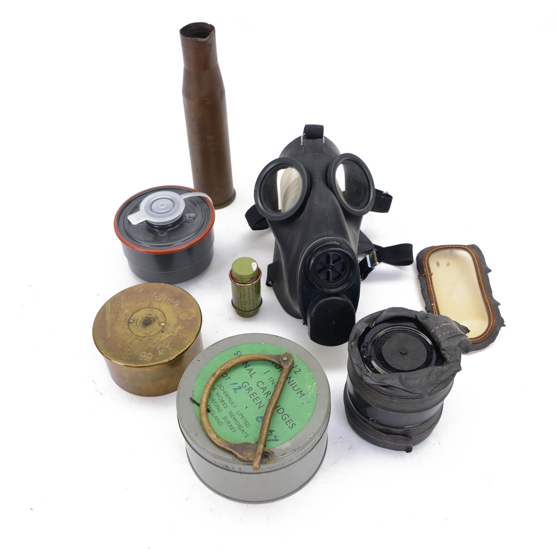  World War II childs gas mask in original box, together with another gas mask and ammunition shell