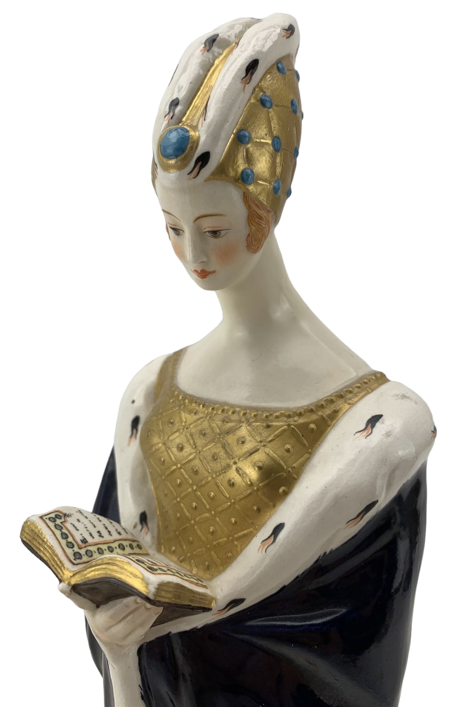 Early to mid 20th century porcelain figure modelled as a Medieval woman, dressed in a blue robe and reading a book, in the style of Dressel & Kister, stamped JV Paris beneath, H31cm 