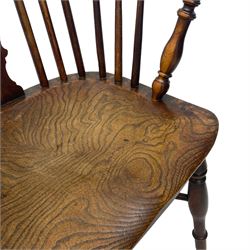 19th century yew wood and elm Windsor armchair, low double hoop stick and pierced splat back, dished seat on turned supports united by crinoline stretchers