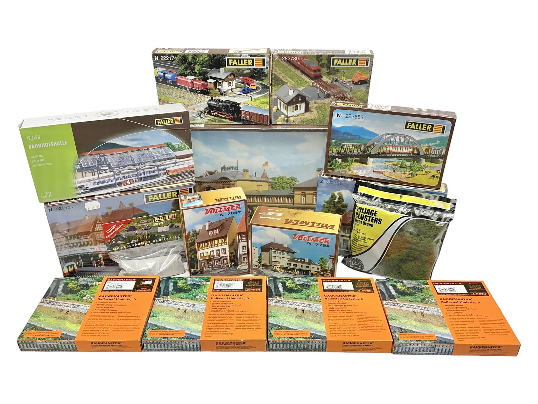 'N' gauge trackside accessories - seven Faller buildings and bridges etc Nos.N212113, N222121, N222583, N222174, N222128, Z282730 & Z282707; two others by Vollmer Nos.N7657 & N7724; four boxes of Gaugemaster Ballasted Underlay; grit and Foliage Clusters