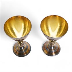 Pair of silver goblets decorated with alternating silver and silver gilt banding with gilded interior on a pierced stem and circular dished foot H14cm London 1970 Makers mark HA