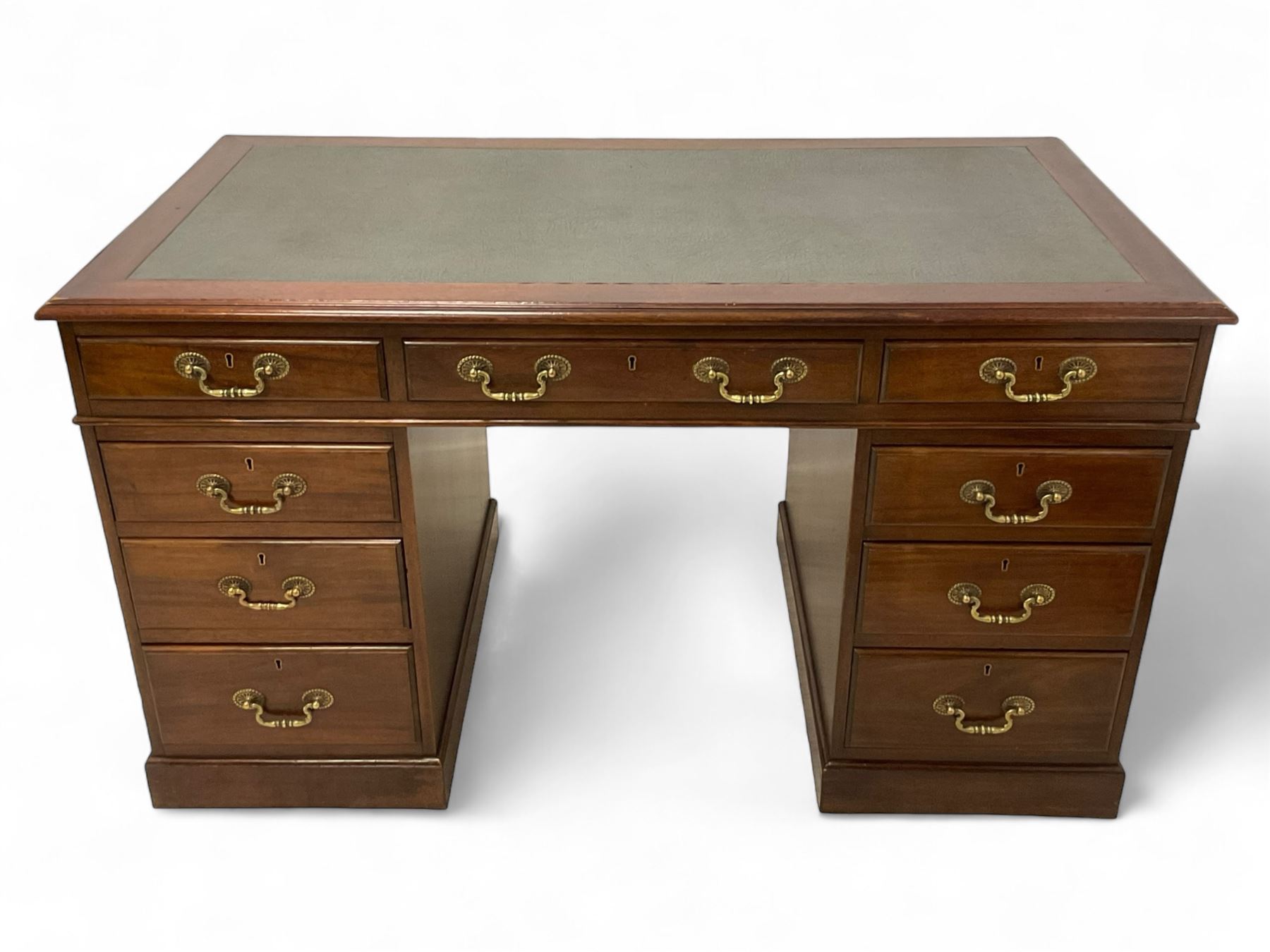 Late 19th century mahogany twin pedestal desk, moulded rectangular top with inset leather, fitted with nine drawers, on plinth base