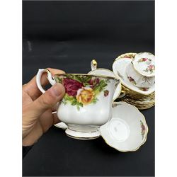 Royal Albert Old Country Roses tea service for six, comprising teapot, milk jug, open sucrier, cups and saucers, dessert plates, two trinket dishes covered jar and clock