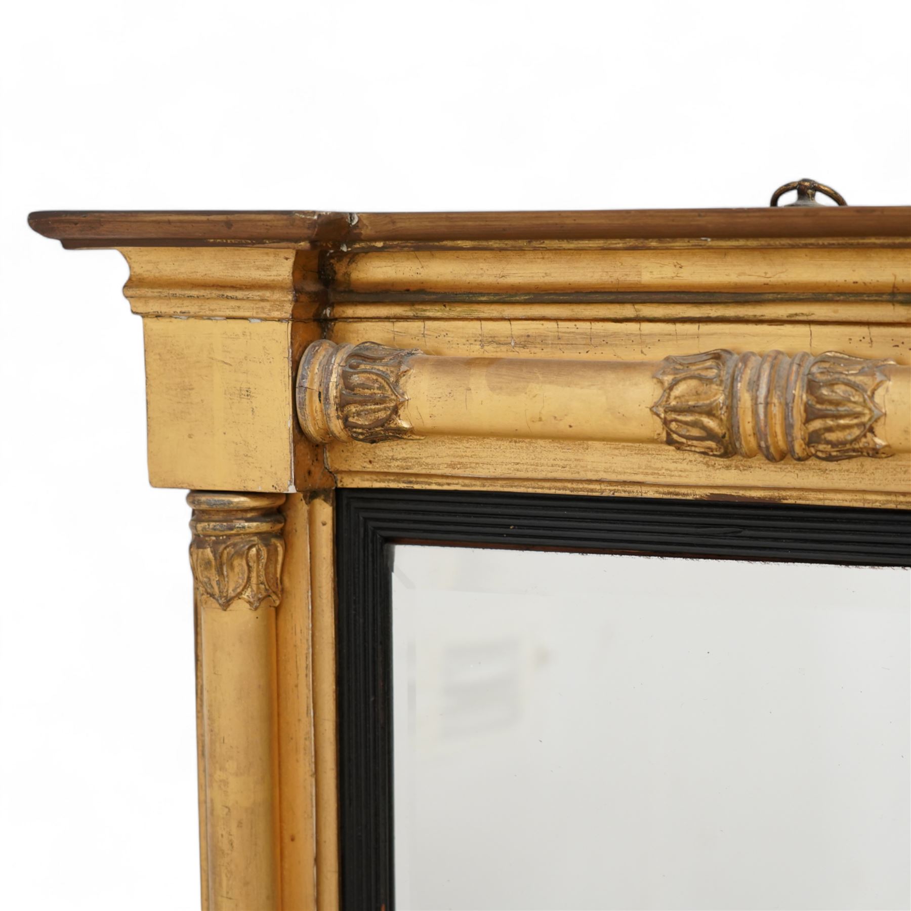 Regency gilt and gesso framed pier glass mirror, inverted break-front pediment over acanthus moulded half pilasters of Neoclassical design, rectangular bevelled plate within ebonised reeded slip