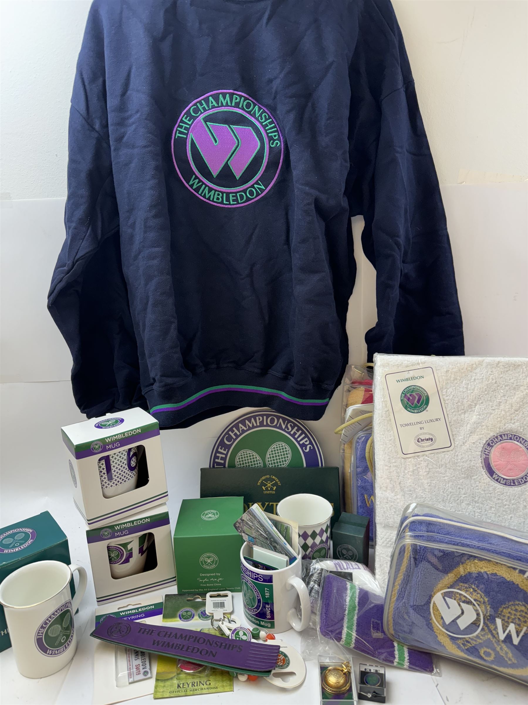 Collection of Wimbledon tennis memorabilia, including towels, programs, mugs, t-shirt, keyrings, ephemera etc