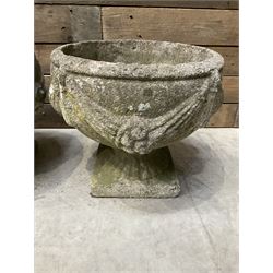 Pair of circular cast stone circular planters, and a similar pair decorated with swags (4)