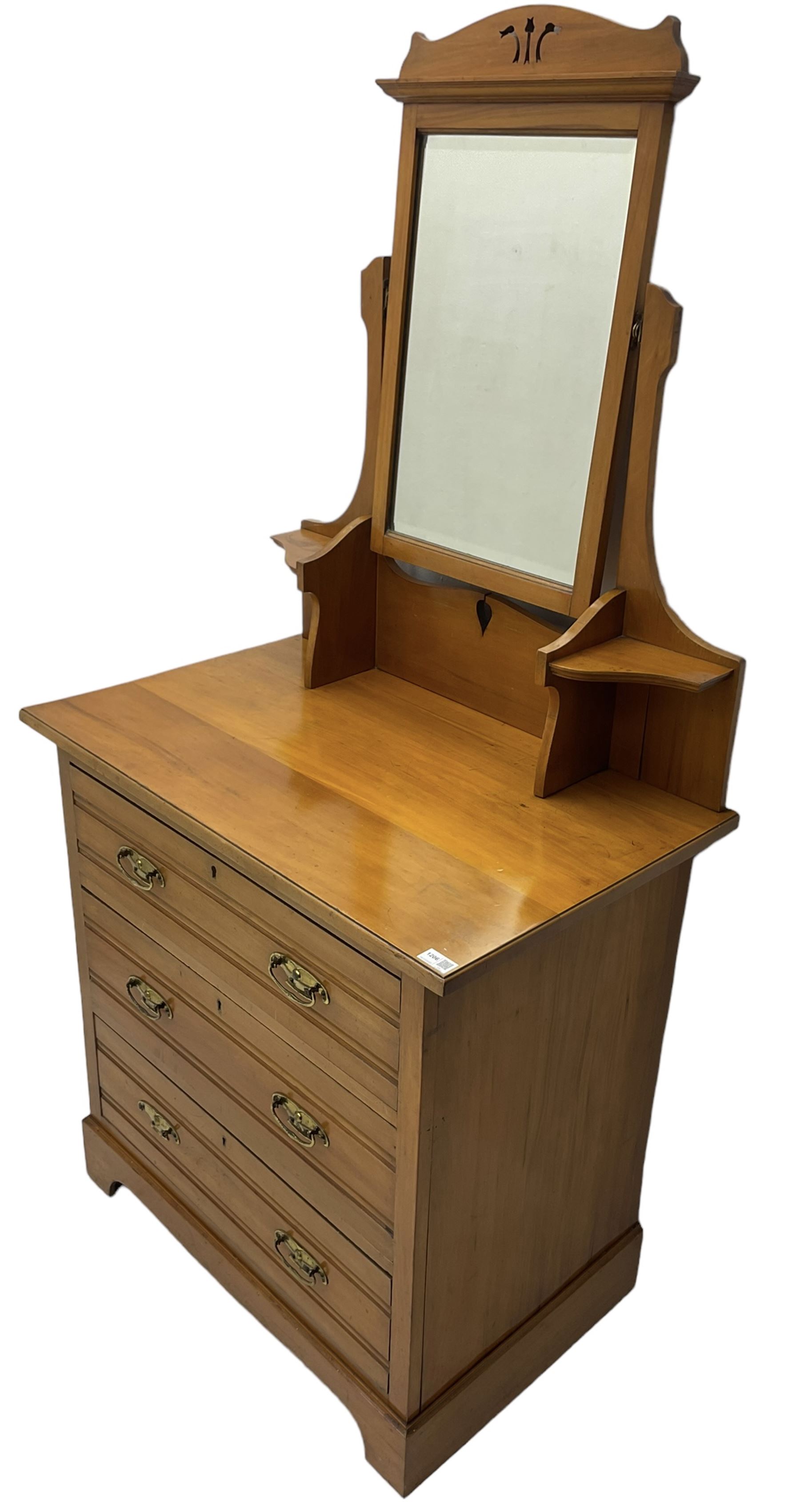 Edwardian satin walnut dressing chest, raised bevelled mirror back, the base fitted with three drawers