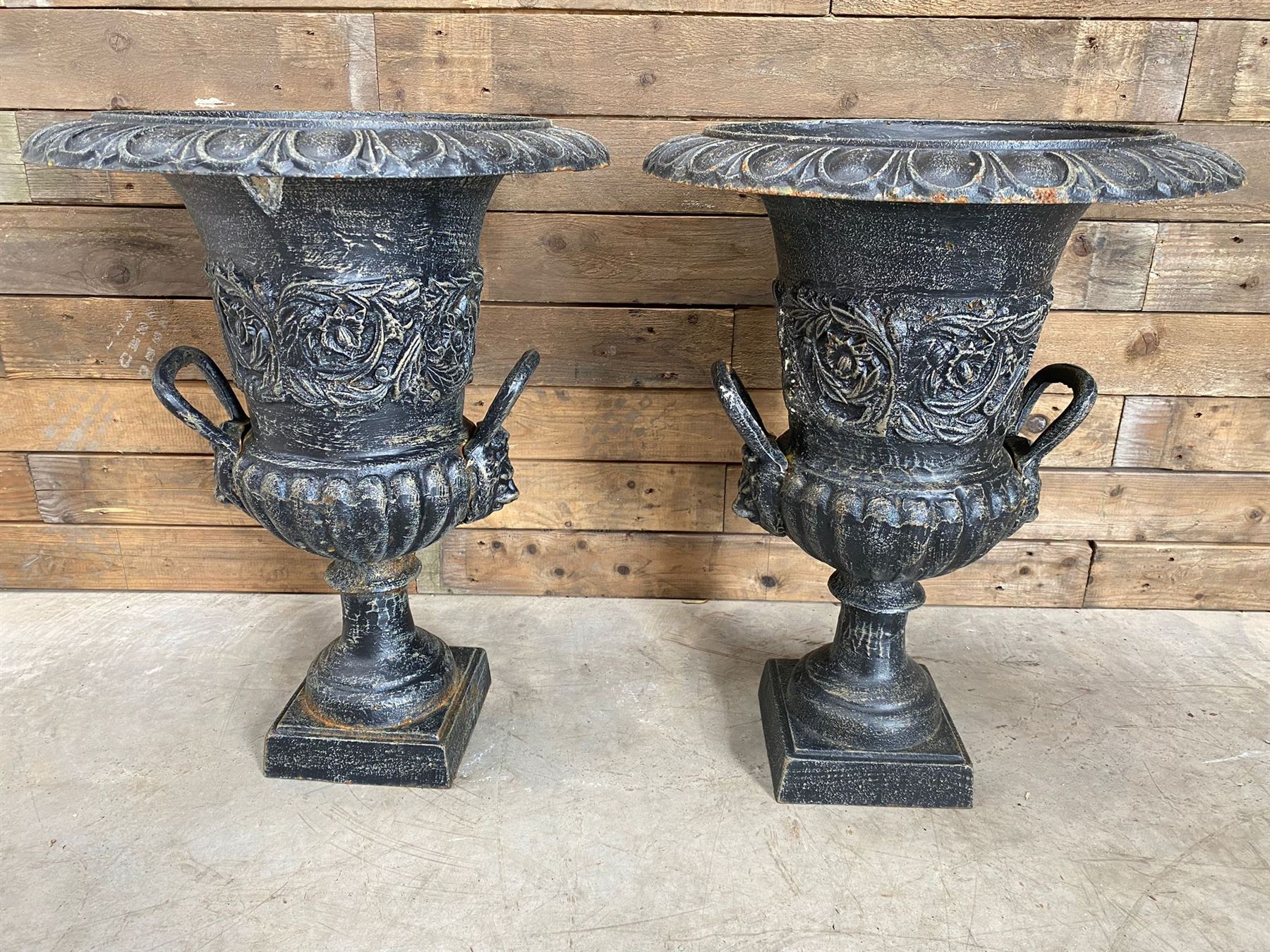 Pair of Victorian design ornate black painted cast iron garden urns, egg and dart rim, tapering column on pedestal base H63, D48