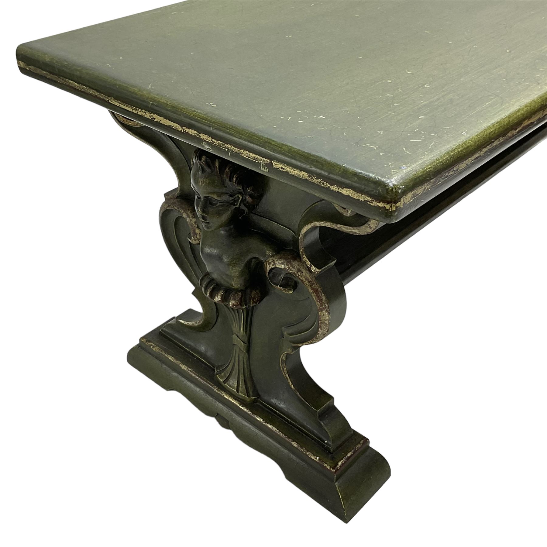 Italian design coffee table in green marbled finish, moulded rectangular top over shaped end supports mounted by putti caryatids and scrolls, stepped and moulded sledge feet