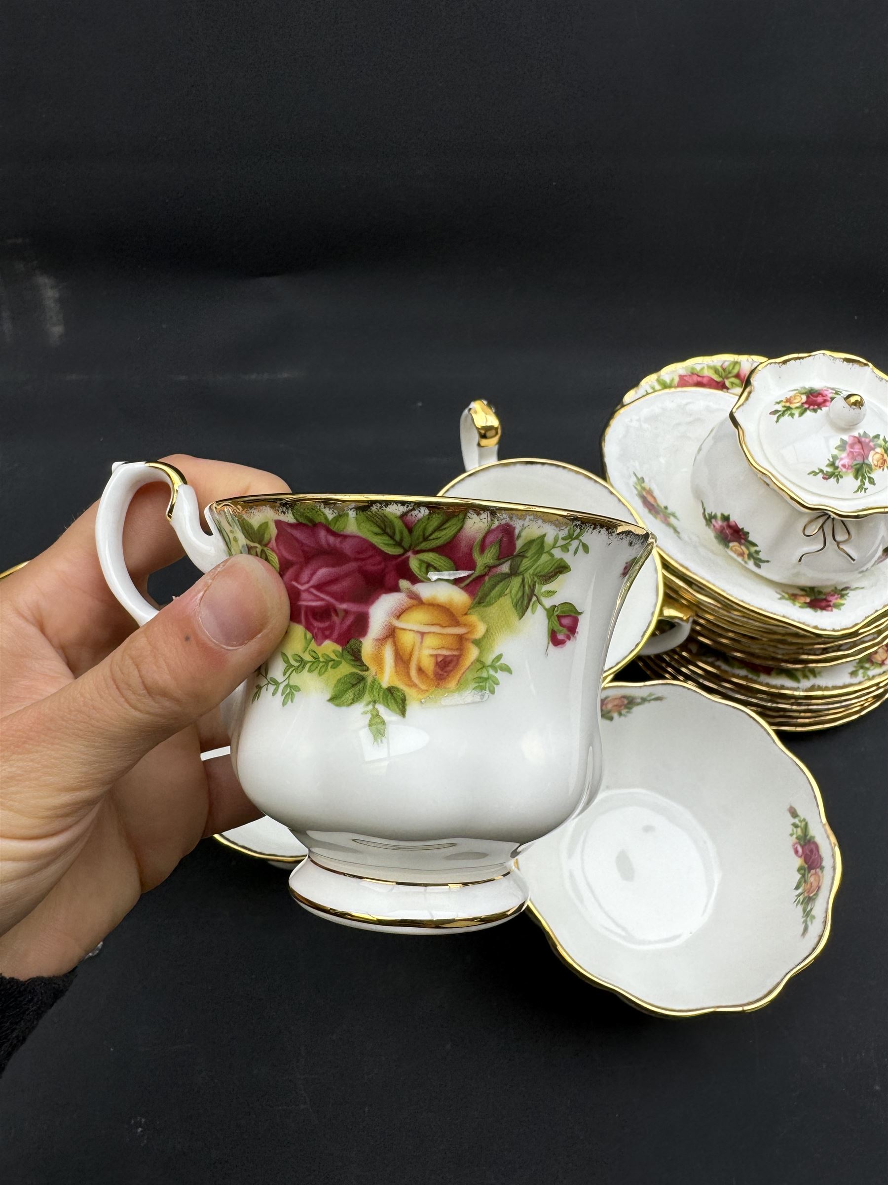 Royal Albert Old Country Roses tea service for six, comprising teapot, milk jug, open sucrier, cups and saucers, dessert plates, two trinket dishes covered jar and clock