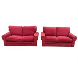 Pair of two seat sofas, upholstered in red fabric