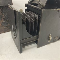 Early 20th century Adams and Co 'Videx' folding plate camera, in original leather carrying case, with various quarter plates