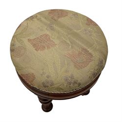 Pair of Victorian walnut circular stools, cushioned seats upholstered in floral pattern fabric, moulded seat rail over turned supports 