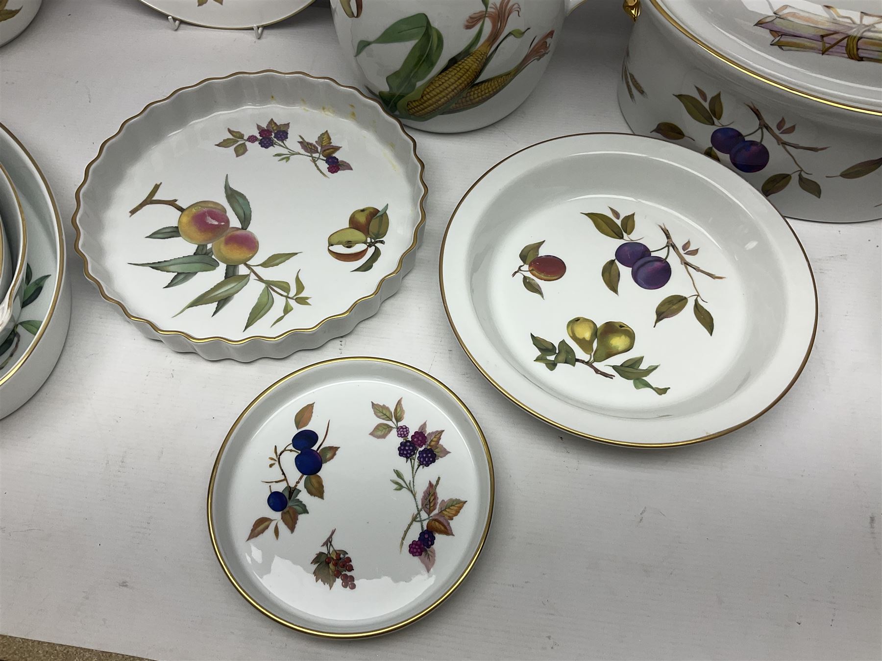 Royal Worcester Evesham pattern, including covered pot de cremes, twin handle tureen, serving dishes, flan dishes, side plates etc  