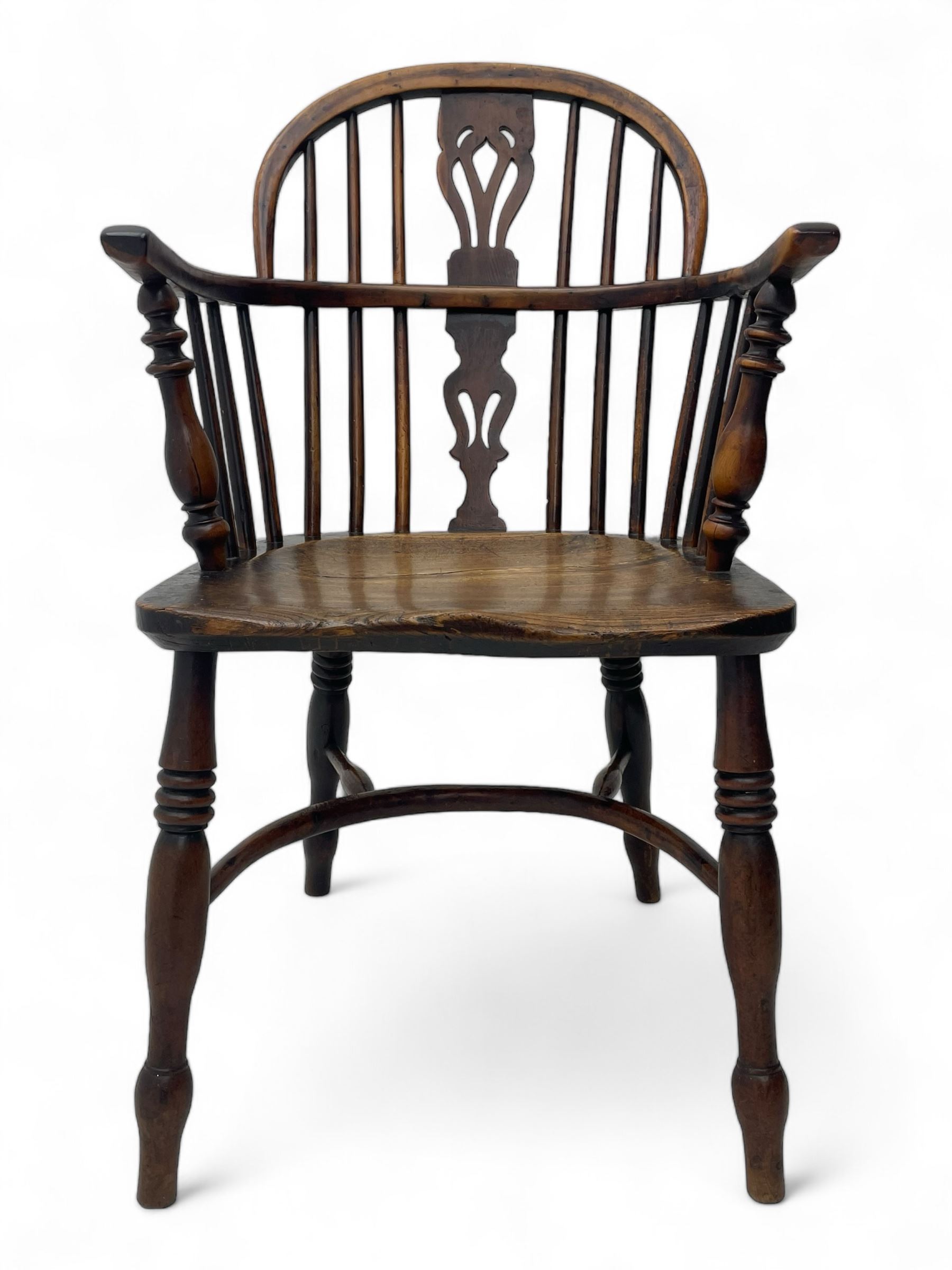 19th century yew wood and elm Windsor armchair, low double hoop stick and pierced splat back, dished seat on turned supports united by crinoline stretchers