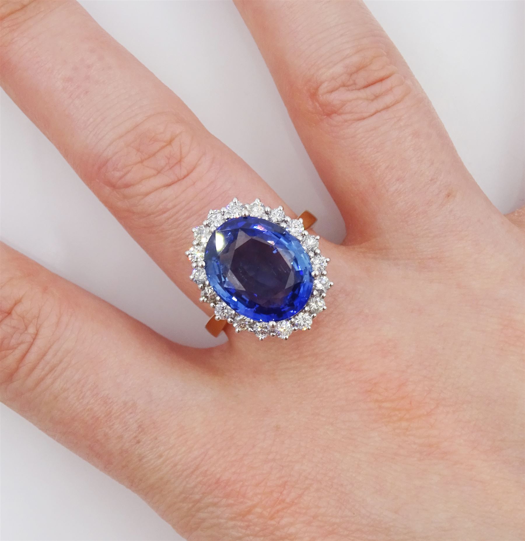 18ct gold oval cut unheated sapphire and round brilliant cut diamond ring, sapphire 7.46 carat, total diamond weight approx 0.70 carat, with Reunigem-Lab report