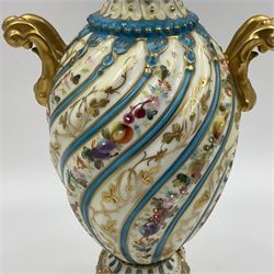 Pair of late 19th/early 20th century Sevres style vases and covers, of baluster form with gilt scroll handles and domed covers, the wrythen fluted bodies decorated with alternating bands of painted fruit and flowers and gilt vines, upon a white and celeste blue ground, with printed and impressed marks beneath, H22.5cm 