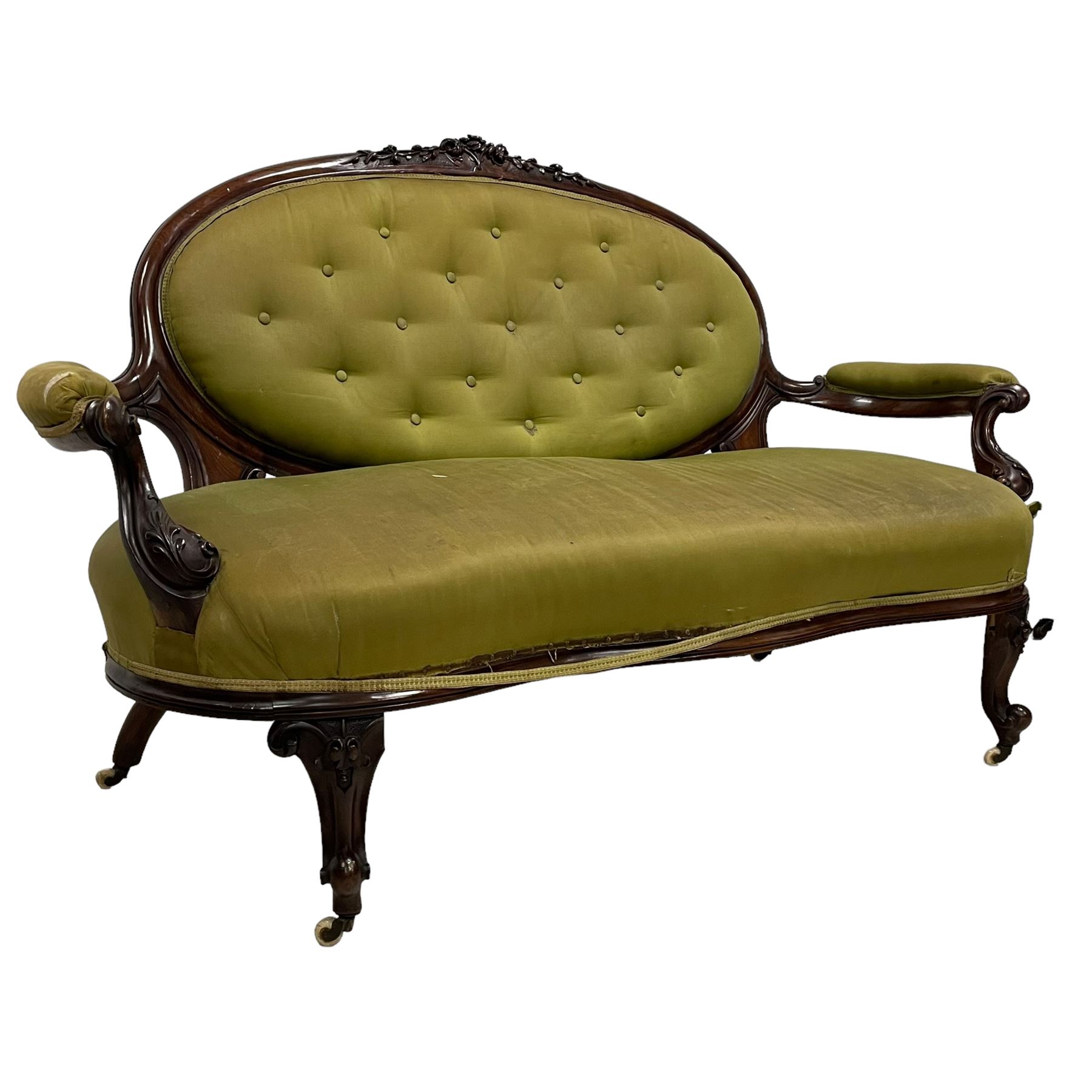 Victorian carved walnut framed two seat settee, cresting rail carved and moulded with a posy of roses and trailing foliate, over an oval back with scrolled arm terminals, serpentine fronted seat over cabriole supports with bell-flower carved knees, buttoned back and sprung seat upholstered in olive green fabric