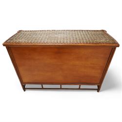 20th century rattan and cane chest in neutral tones, fitted with six drawers, lattice woven apron over splayed feet