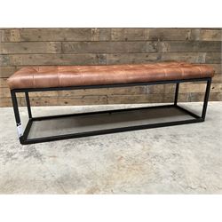 Two rectangular metal framed benches, upholstered in buttoned tan leather