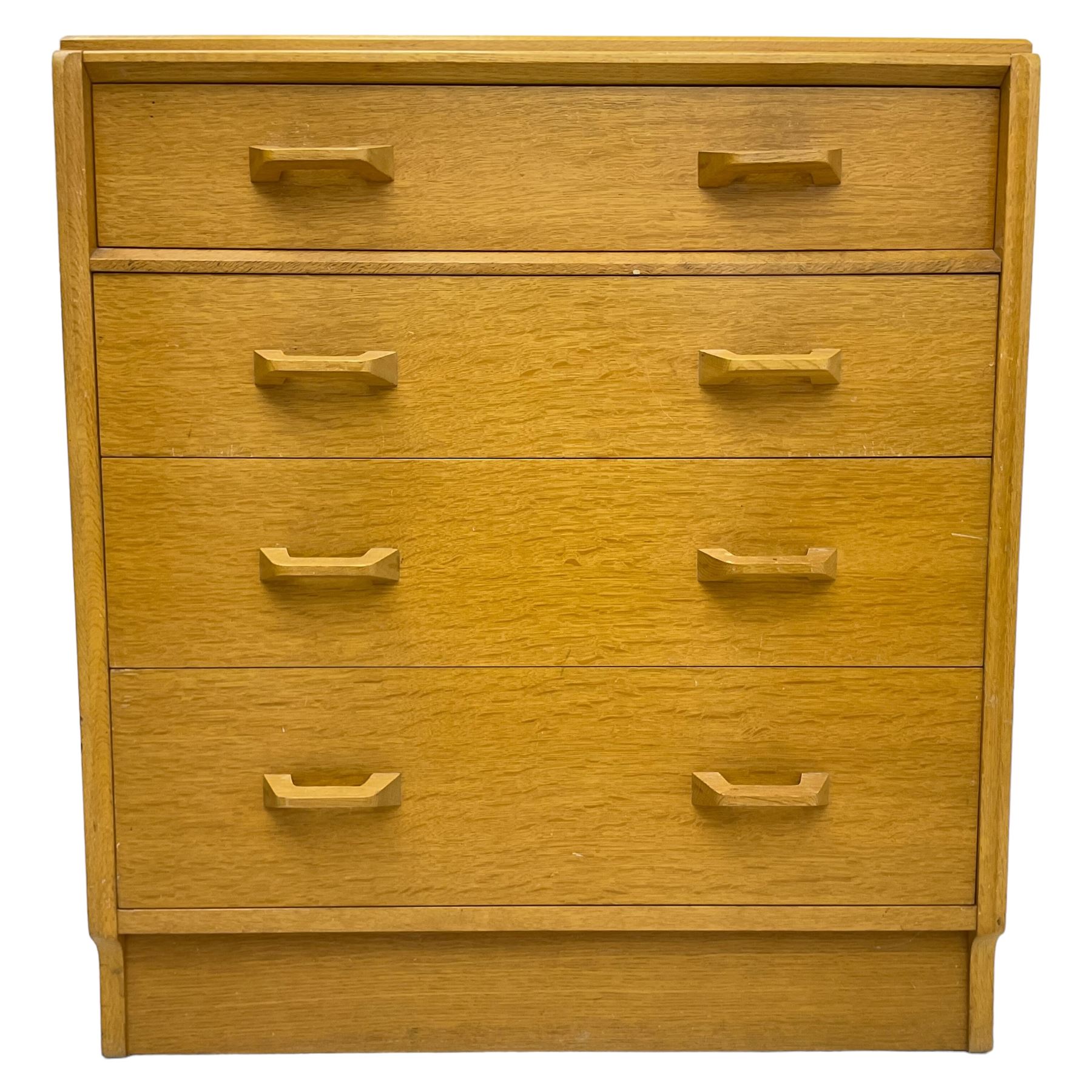 E. Gomme for G-Plan - 'Brandon' light oak chest, fitted with four long drawers, on skirted base