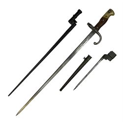 British No.4 Mk.II spike bayonet, unmarked, with 20cm round steel blade; in steel scabbard L26cm overall; Russian Mosin-Nagant rifle socket bayonet with 43cm cruciform blade, lacking scabbard; and French St. Etienne Gras bayonet dated 1876, No.G49169/178, lacking scabbard (3)