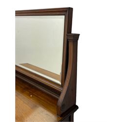 Late 19th century walnut dressing table, wide rectangular bevelled swing mirror in moulded frame, shaped horns carved with scrolls, moulded rectangular top over seven drawers, on square tapering supports with spade feet 