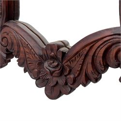 Pair of carved hardwood wall mirrors, shaped floral carved pediment over trailing and scrolled foliage decoration, plain mirror plate 