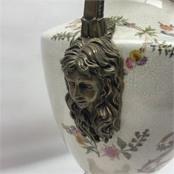 Wong Lee, twin handled ceramic urn with enamelled floral decoration and bronzed metal mounts, upon a square base, marked to base, together with similar twin handled urn with enamelled Cherub decoration, largest H44cm