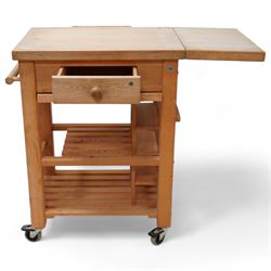 Late 20th century beech kitchen preparation trolley, rectangular drop-leaf butcher's block top, fitted with single drawer and knife slots, over two slatted tiers, on castors