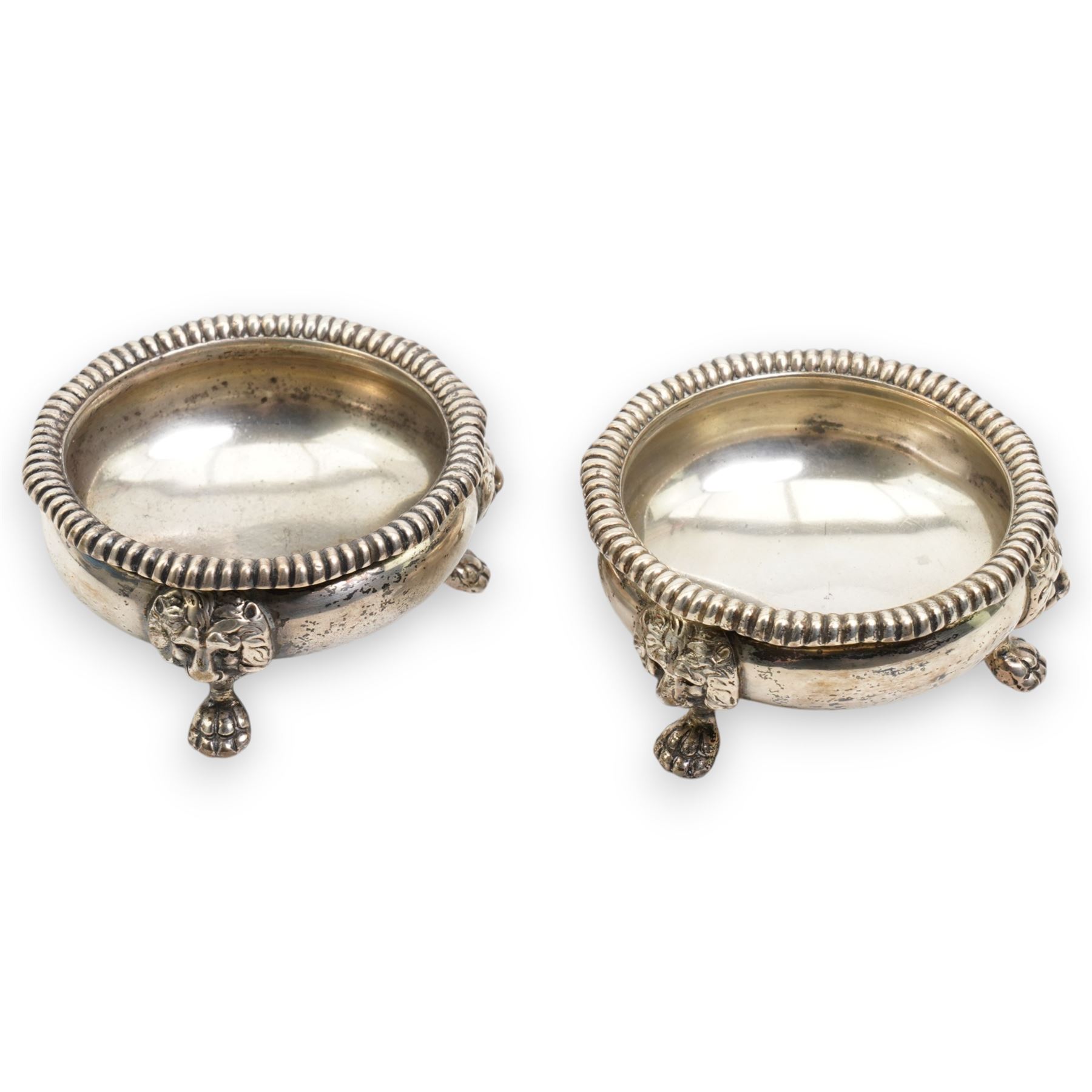 Pair of early 20th century silver salts, cauldron form with gadrooned borders, upon three lion mask and paw feet Birmingham 1917 Maker Wilson & Gill, 