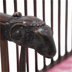 19th century mahogany two-seat bench, moulded cresting rail over slatted back with rams head carved terminal, the front arm supports in the form of fruit cornucopias, rectangular seat upholstered in pink fabric decorated with animals, anthemion carved supports carved as rams legs with hoof terminals 