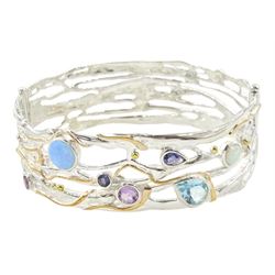 Silver and 14ct gold wire opal, topaz, amethyst and iolite hinged bangle, stamped 925