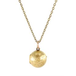 Early 20th century 18ct gold hinged ball pedant, the interior with magnifying glass, on 15...