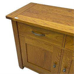 Oak side cabinet, fitted with two drawers and two panelled doors