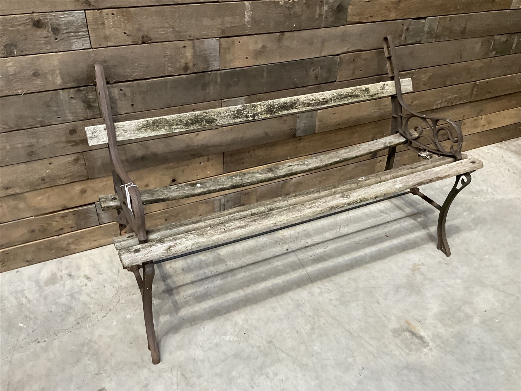 Pair of faux bois cast metal bench ends; together with wooden slatted bench with metal ends