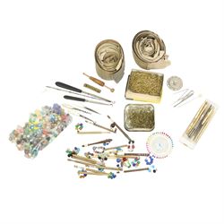 19th century and later lace maker's bone and turned wooden bobbins with glass spangles, pins, patterns, five cushions, related book and other accessories 