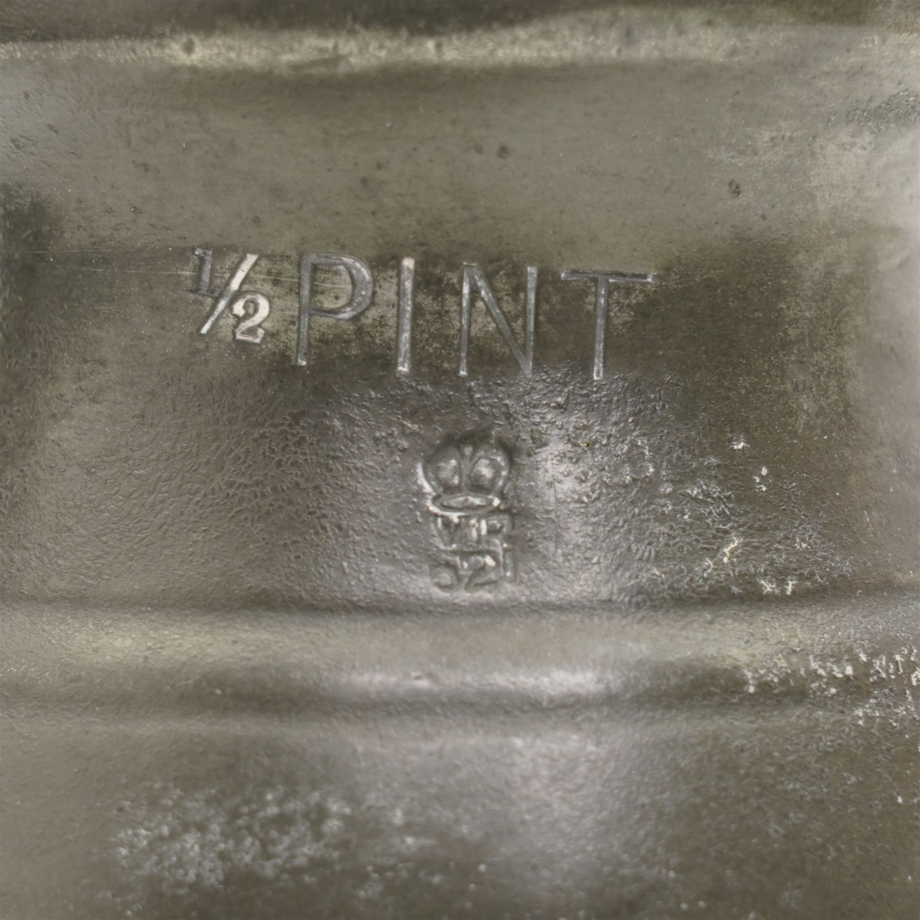 18th century pewter tankard, circa 1770, with scroll handle and acanthus leaf thumbpiece, touch marks and crowned X, H13cm, together with a Victorian 1/2 pint pewter measure, touch marks, weights and measures inspector verification mark (2)