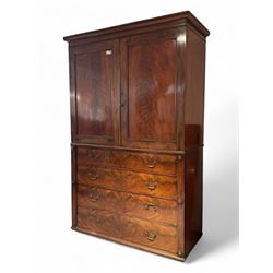 Victorian mahogany linen-press, moulded cornice over two figured panelled doors, the inter...