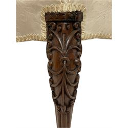 Georgian Irish mahogany dressing stool, overstuffed seat upholstered in in ivory damask fabric, the cabriole supports decorated with moulded interlacing scroll motifs with mycelium cap detail, over lobe carvings terminating to large paw feet