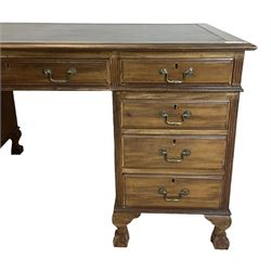 Georgian design twin pedestal desk, rectangular top with green leather inset, fitted with nine drawers, on cabriole supports with ball and claw feet 